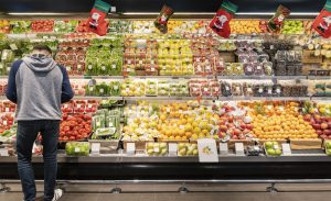 Man Choice Vegetable at the Supermarket